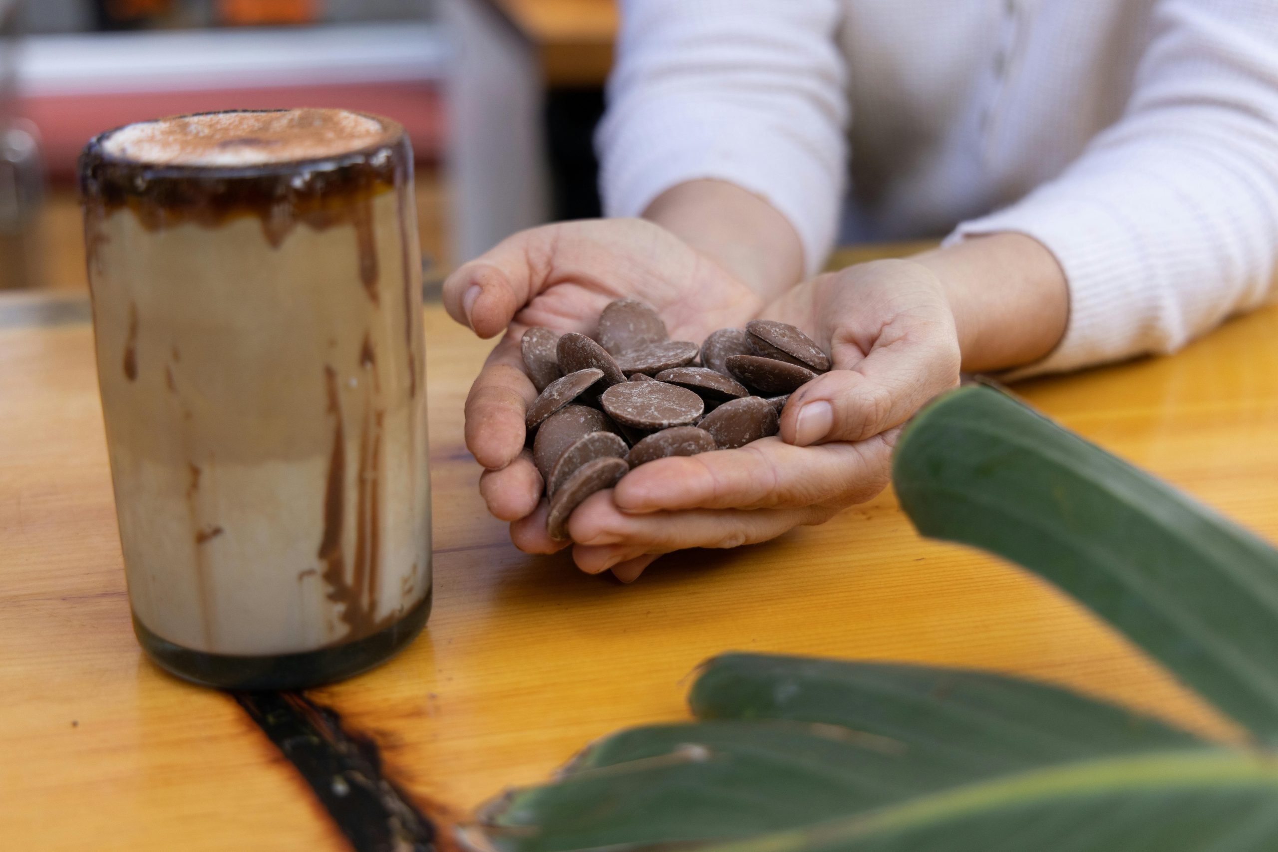 Warm beverage served with chocolate, captured in a cozy indoor setting, enhancing the mood of a perfect start to the day.