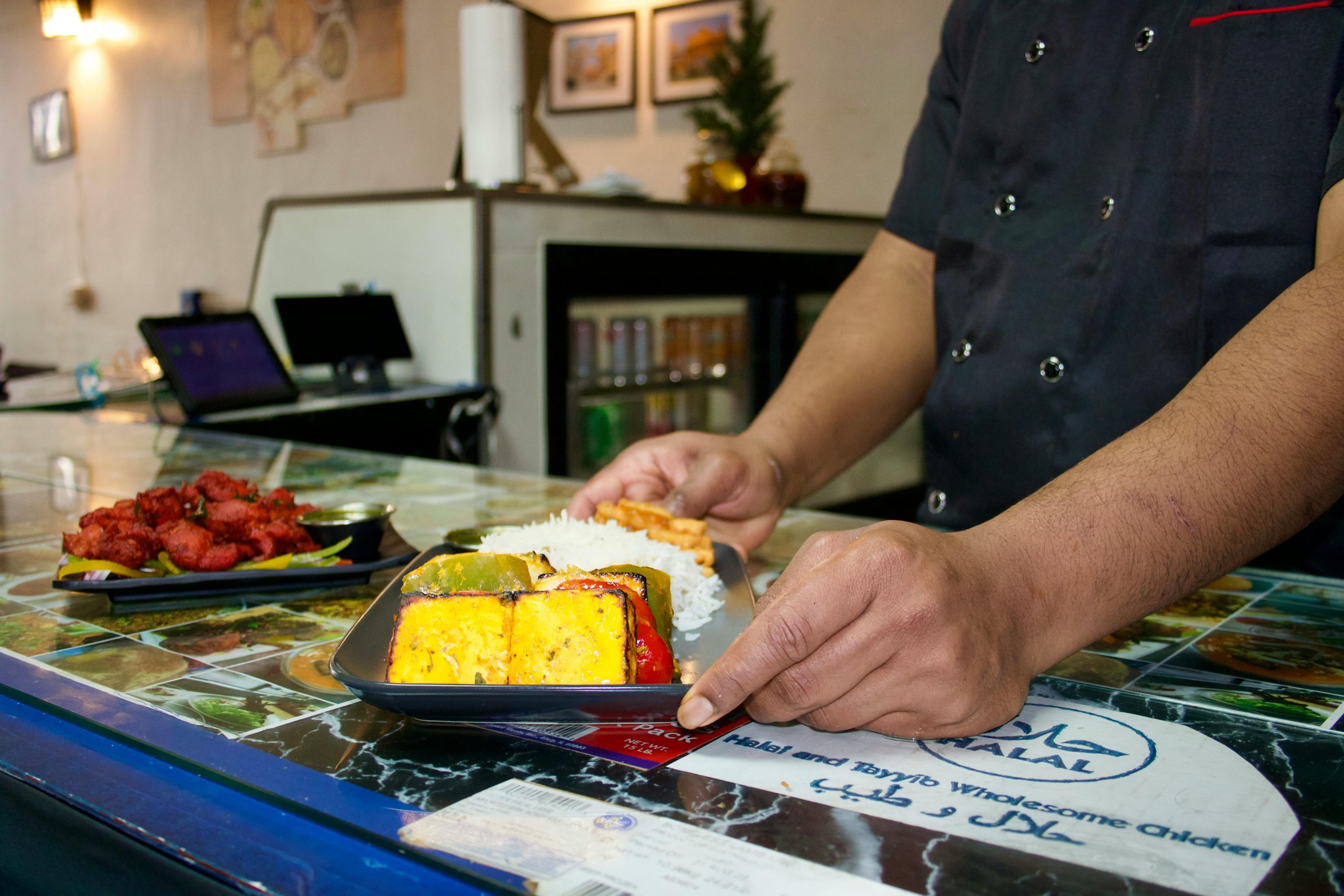 Close-up of freshly prepared Indian cuisine with colorful vegetables and cooked rice.