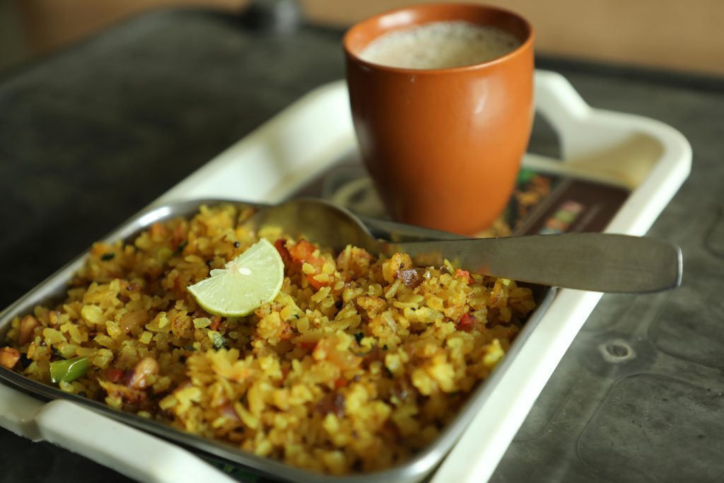 Close-up of fried rice and coffee cup on a tray, an ideal breakfast choice.