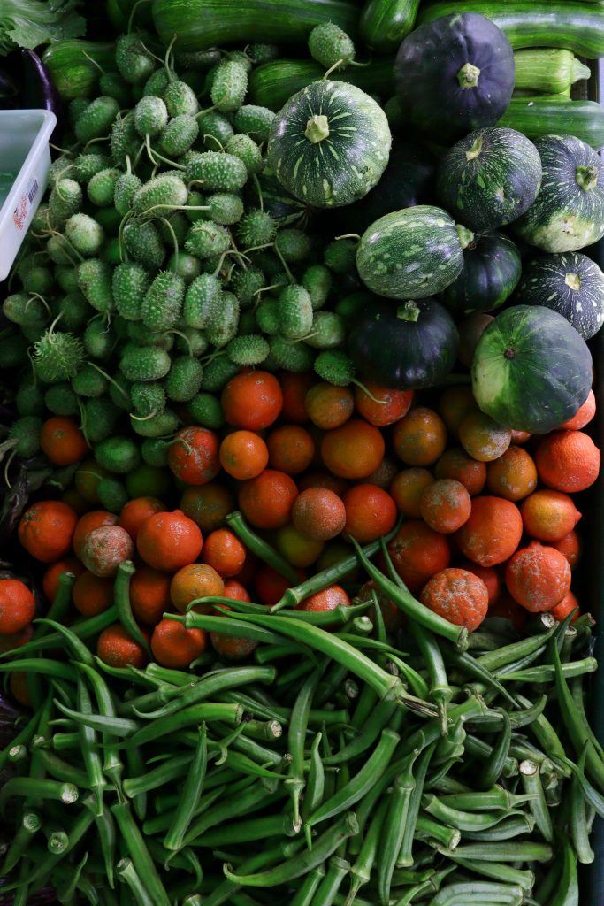 Vibrant display of green and red vegetables, showcasing freshness and variety.