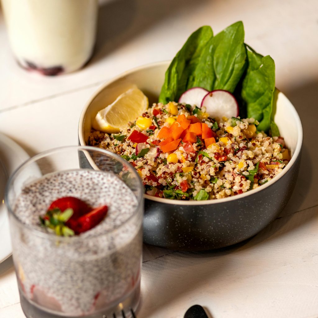 Delicious quinoa salad with veggies and chia pudding perfect for a nutritious meal.